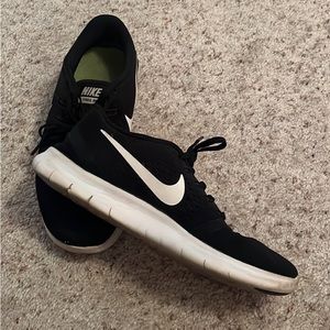 Black and White Nike running shoes. Size 7.5